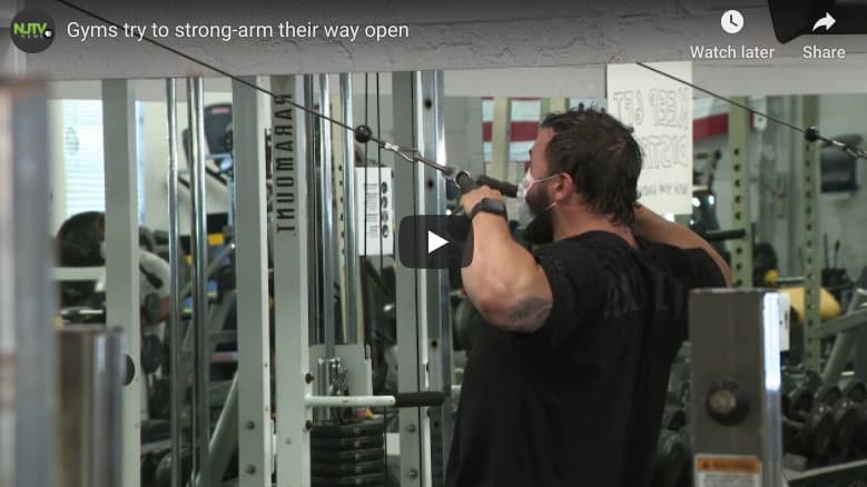Gyms try to strong-arm their way open